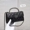 CHANEL Quilted Lambskin Top Handle Clutch