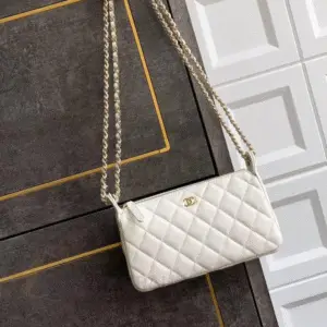 CHANEL Gold Ball Mini Case Lambskin Crossbody Bag